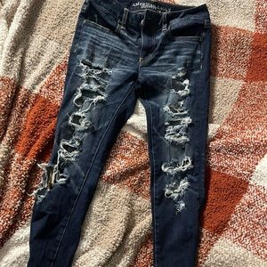 dark destroyed american eagle skinny jeans or jeggings size 2